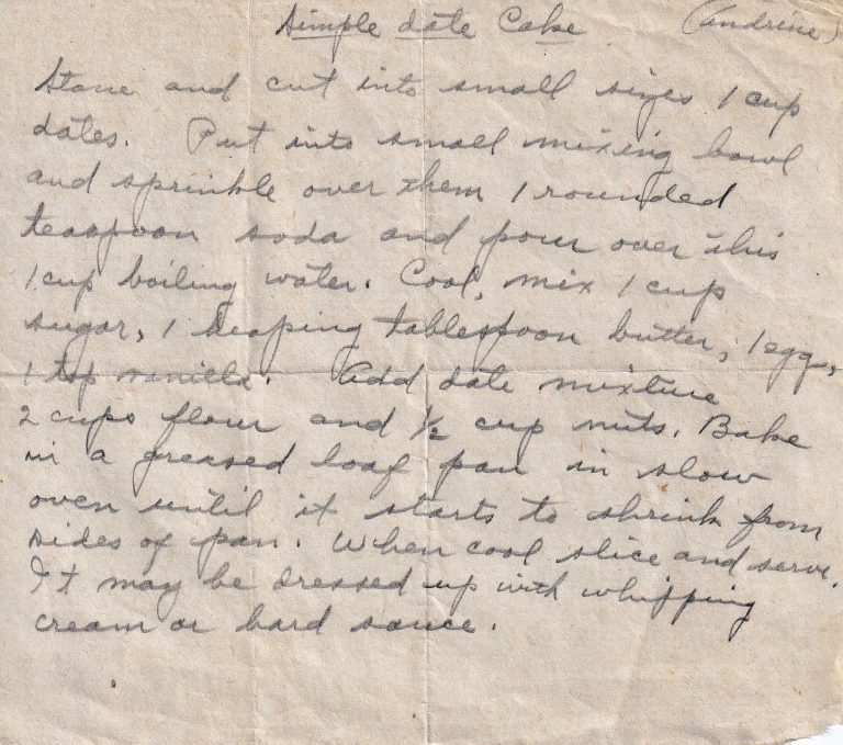 Andrine’s Simple Date Cake recipe on aged paper with ingredients and directions for a date and nut cake baked in a loaf pan.