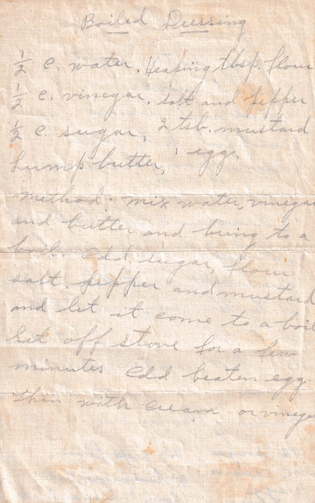 Handwritten Boiled Dressing recipe on aged paper with ingredients and directions for a cooked vinegar, mustard and egg dressing.