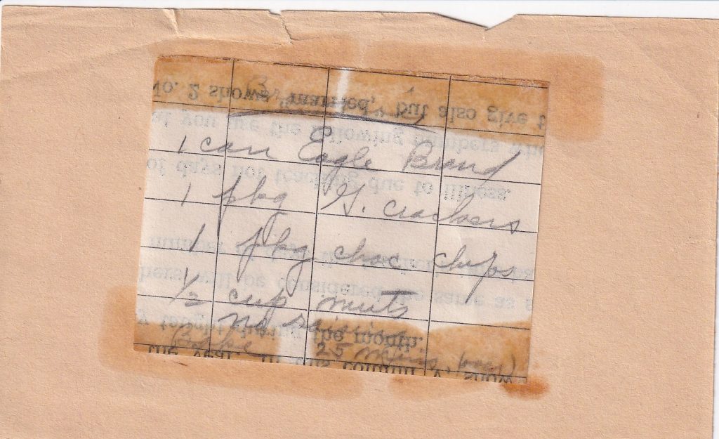 Small handwritten Eagle Brand recipe fragment taped to paper, listing ingredients but missing most of the directions.