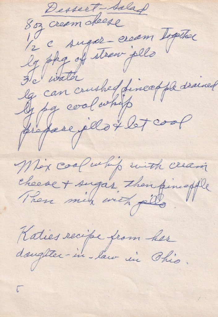 A handwritten recipe for Katie’s Dessert Salad, a fluffy mix of strawberry Jell-O, crushed pineapple, cream cheese and Cool Whip, with a little family trail stretching all the way to Ohio.