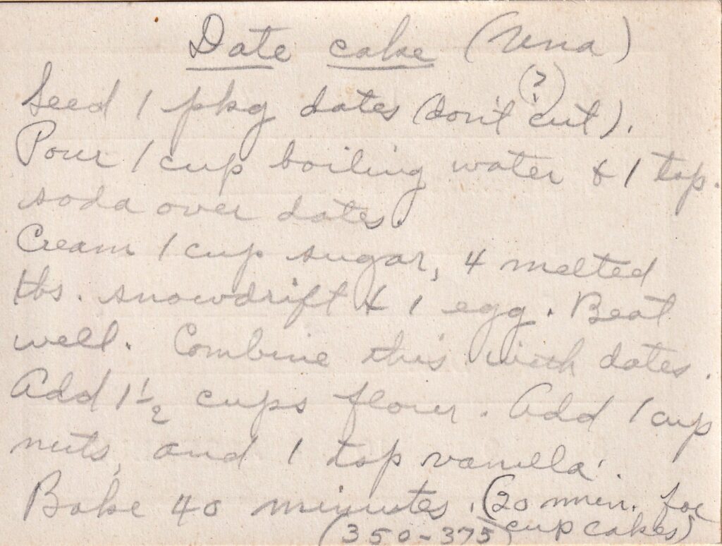 A handwritten recipe for a dark, moist date cake filled with sweet dates and crunchy nuts.